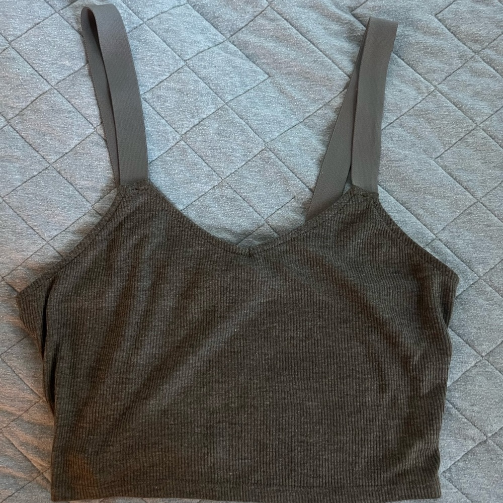 Gray crop top, with thick elastic straps.